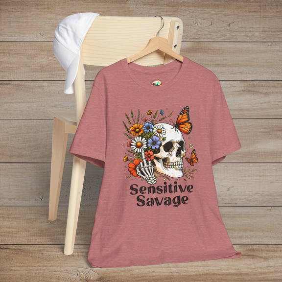 Heather mauve t-shirt with colorful gothic artwork of a skull, flowers, butterflies, and the phrase Sensitive Savage
