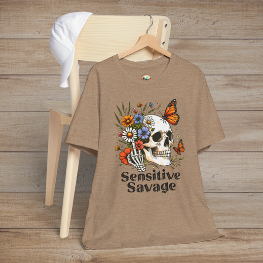Heather tan t-shirt with boho-goth design of a floral-decorated skull, butterflies, and Sensitive Savage text below