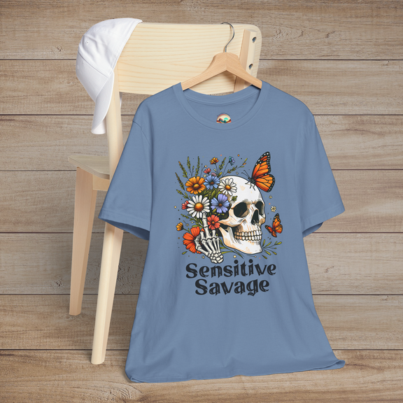 Steel blue t-shirt displaying a skull illustration with vibrant flowers and butterflies with the words Sensitive Savage in bold