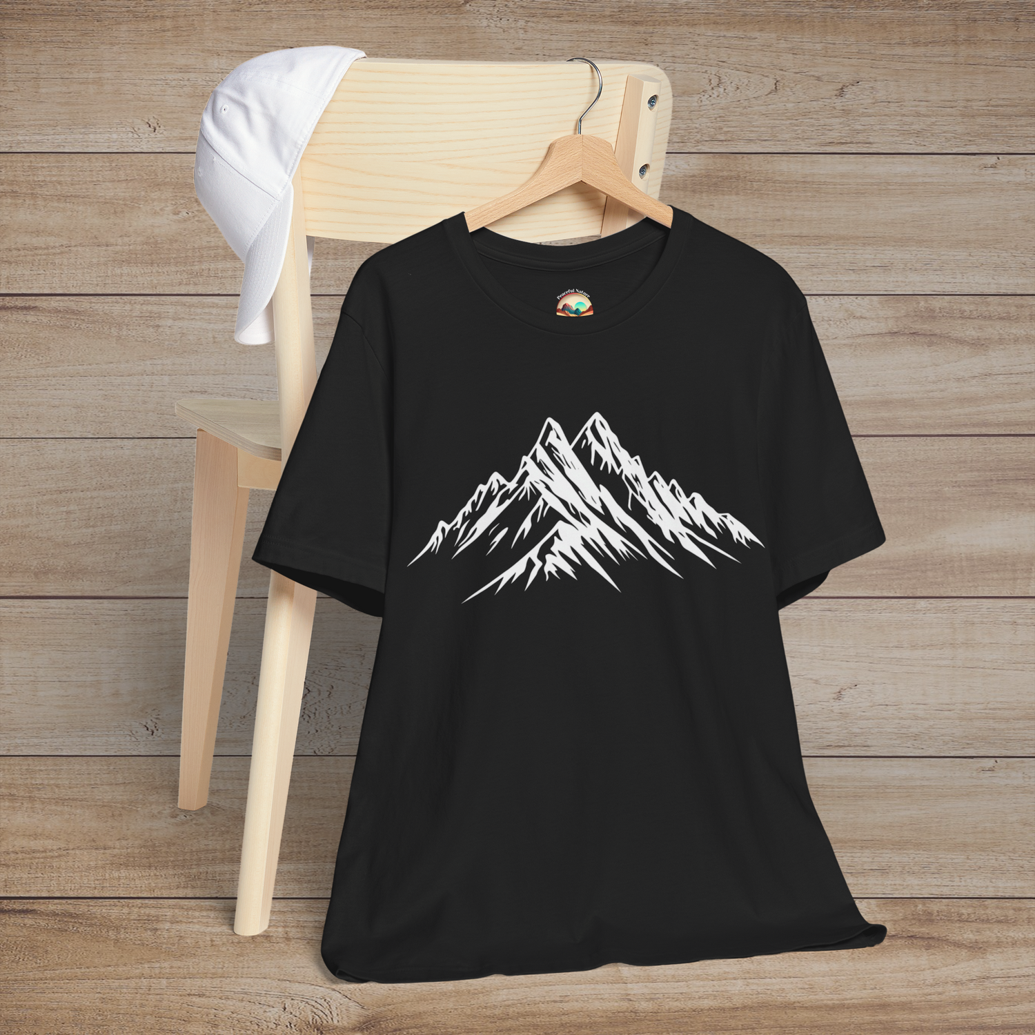 Black t-shirt featuring a minimalist white line drawing of a snow-capped mountain range