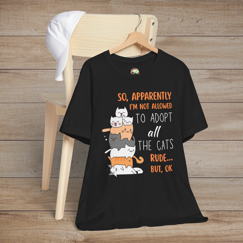 Funny cat adoption quote tee in black – stacked cartoon cats with “So apparently I'm not allowed to adopt all the cats… Rude, but OK” text.