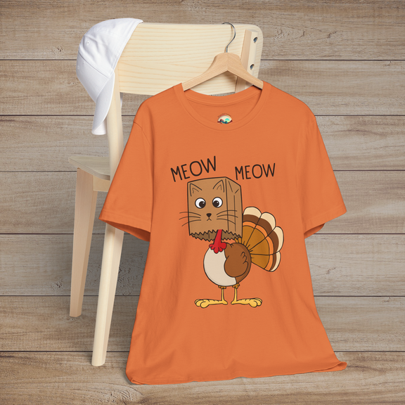 Cartoon cat in turkey costume with “Meow Meow” text on burnt orange unisex tee, perfect for Thanksgiving