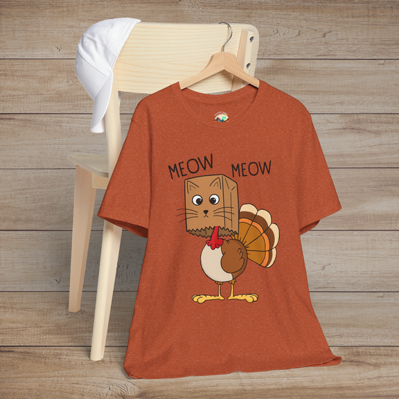 Funny Thanksgiving cat-turkey mashup tee in heather autumn, with quirky “Meow Meow” phrase