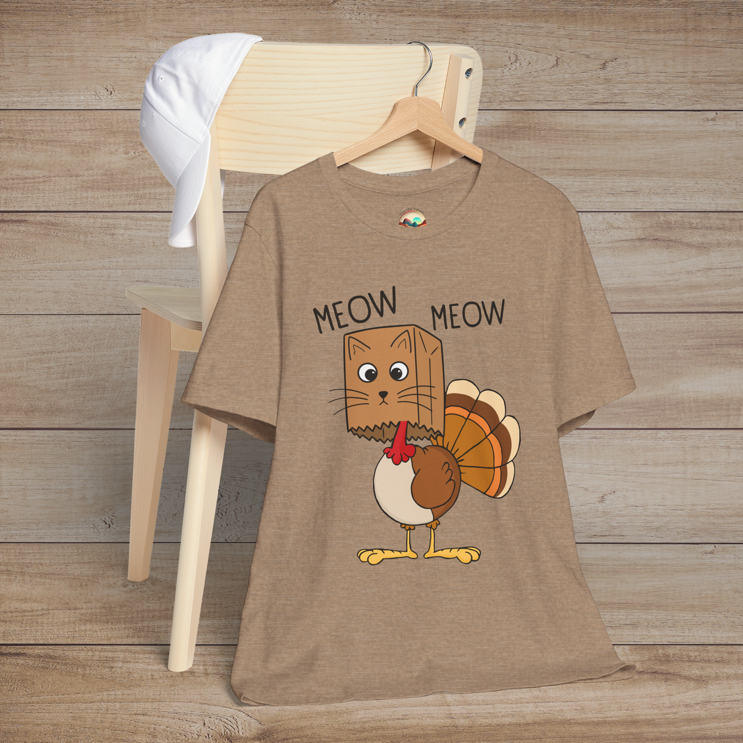 Heather tan Thanksgiving shirt with silly cat wearing turkey costume and “Meow Meow” text