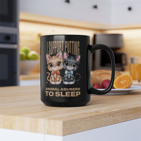 15oz black animal rights mug with bold messaging and two bowtie-wearing cartoon cats, morning kitchen scene.