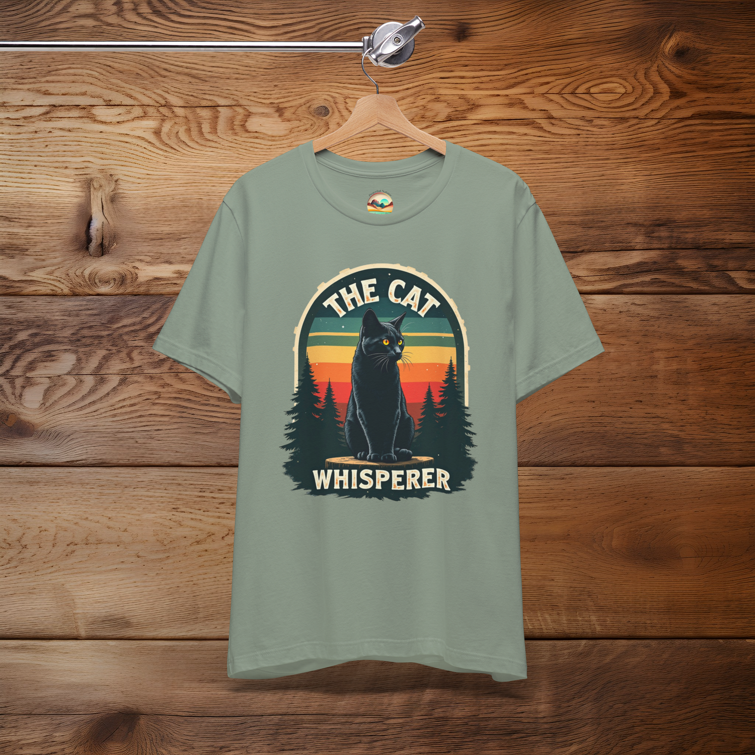 Sage green Cat Whisperer T-Shirt highlighting a black cat in nature with a nostalgic sunset scene, ideal for cat owners and nature lovers