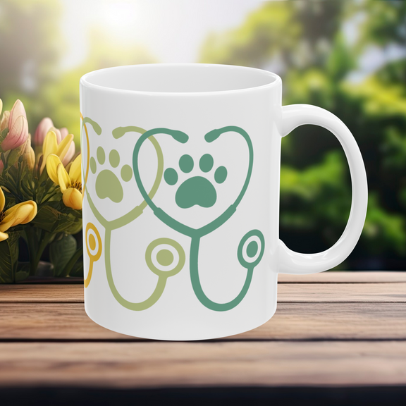 11 oz white ceramic mug with orange and green paw prints – right view