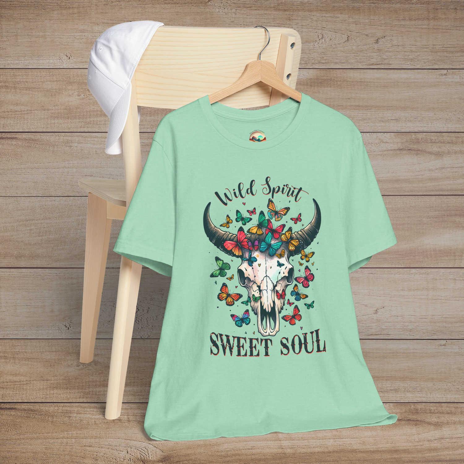 Heather mint Wild Spirit Sweet Soul T-Shirt showcasing a western skull with bright colorful butterflies dreamer tee